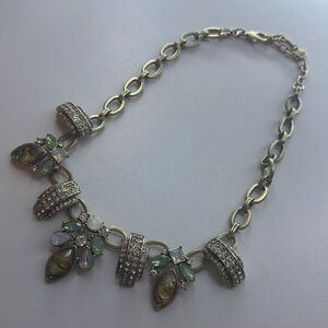 Gold color necklace, chain and gems